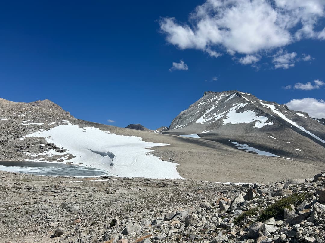 View after cresting the pass. Tyndall on the right with both north rib and northeast ridge visible. Williamson is poking up on the left.